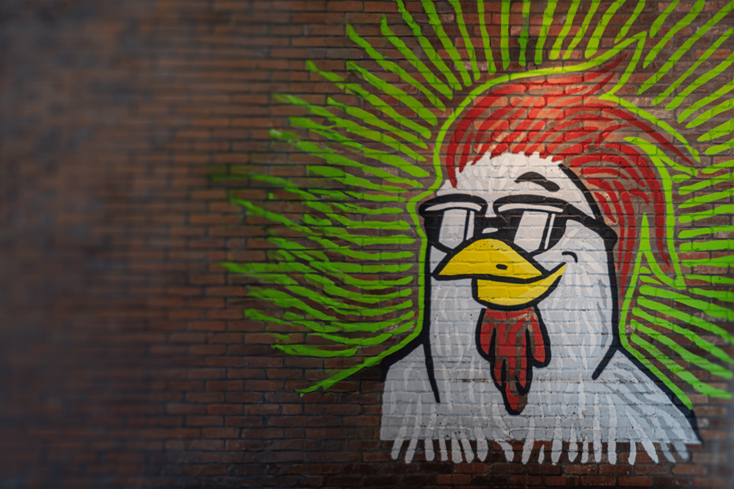 The Chicken Guy! painted on a brick wall